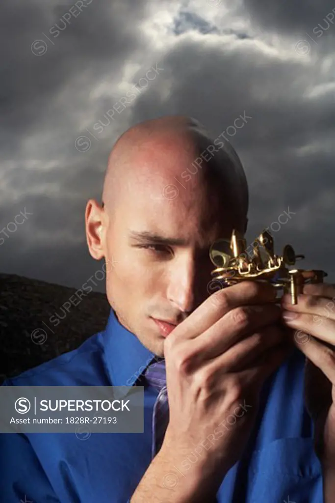 Businessman Looking at Instrument   