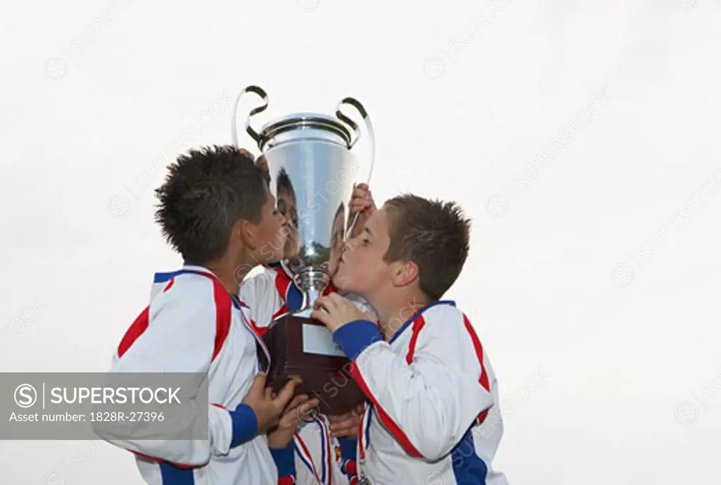 Soccer Players Kissing Trophy   