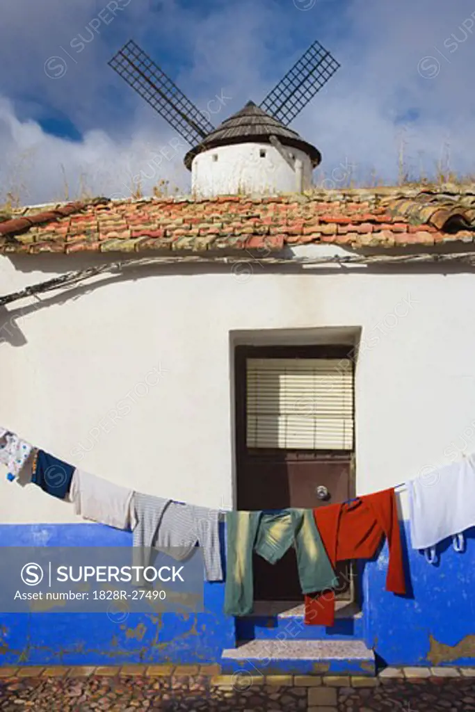 Clothesline and Windmill in Village, Campo de Criptana, La Mancha, Spain   