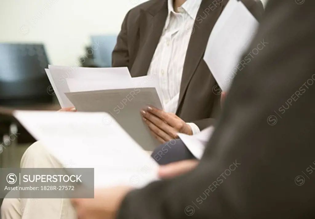 Business People with Paperwork   