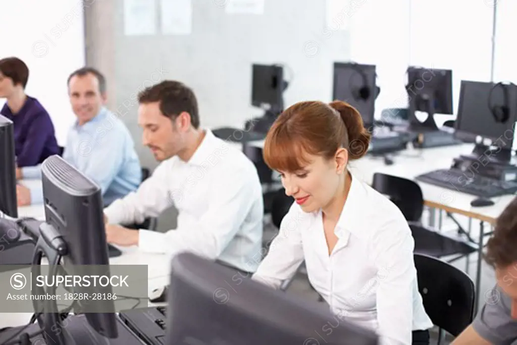 Business People Working on Computers in Office   