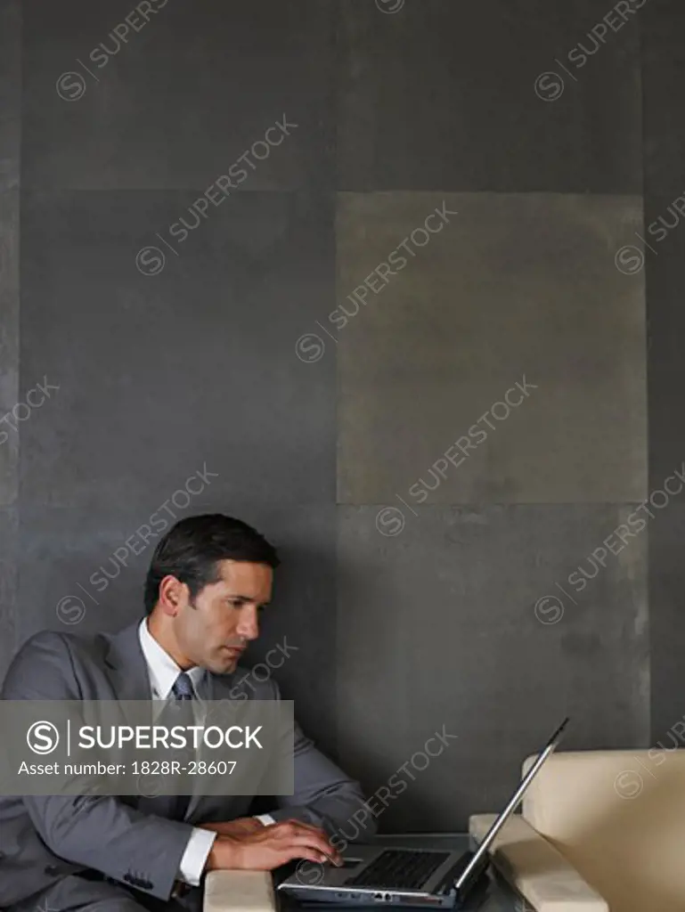 Businessman Using Laptop Computer   