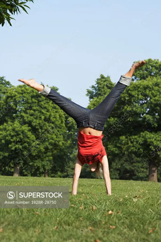 Woman Performing Somersault   