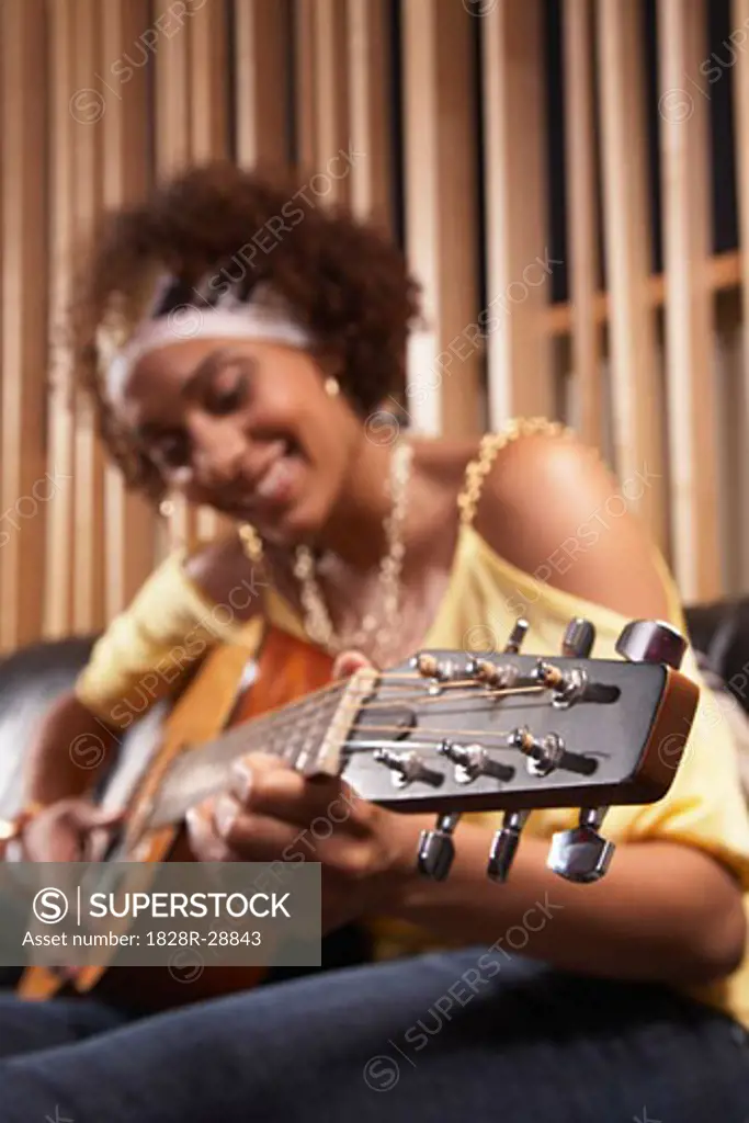 Woman Playing Guitar   