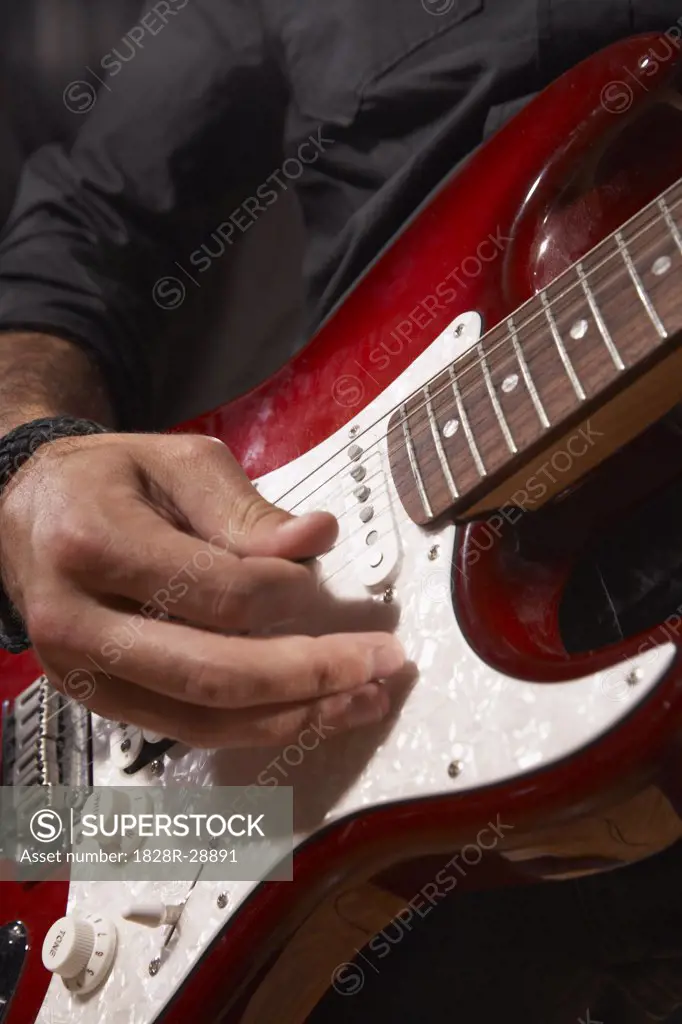 Person Playing Guitar   