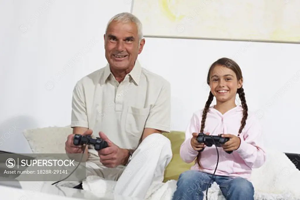 Grandfather and Granddaughter Playing Video Games   