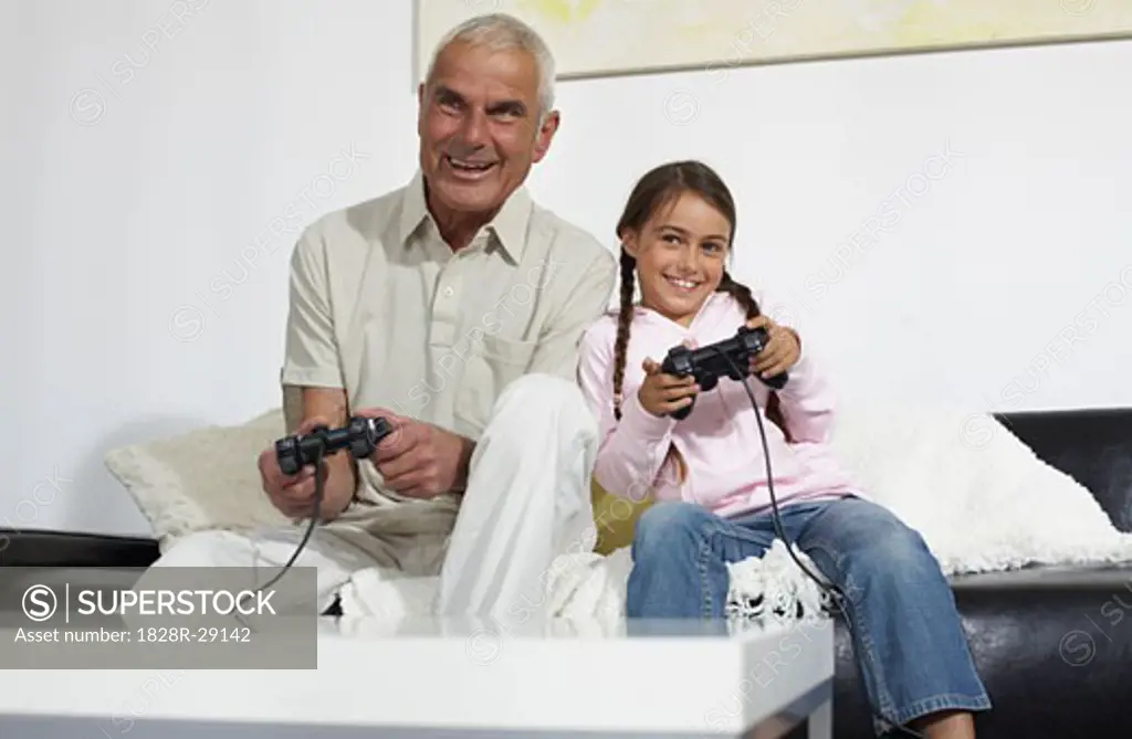 Grandfather and Granddaughter Playing Video Games   