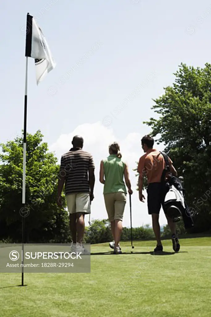 Golfers Walking off Green   