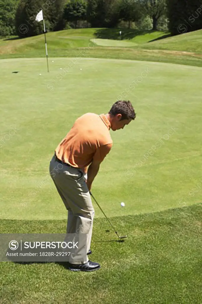 Man Playing Golf   