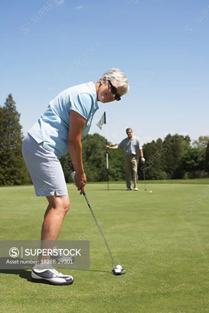 Couple Golfing   