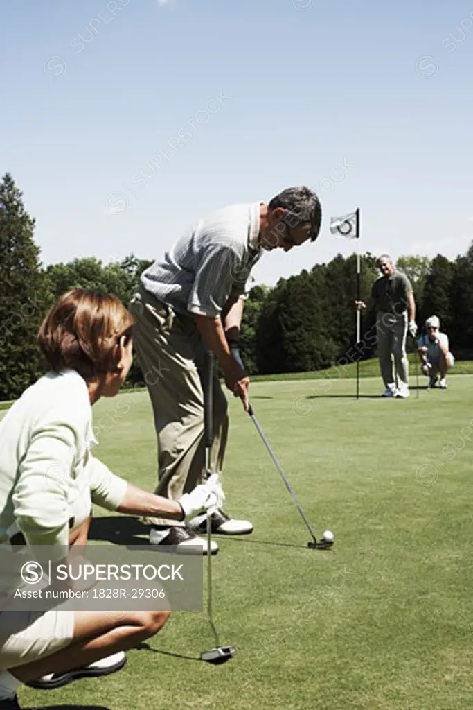 Couples Playing Golf   