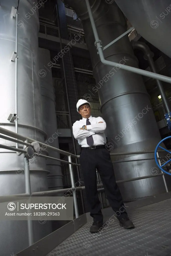 Businessman in Water Treatment Plant   