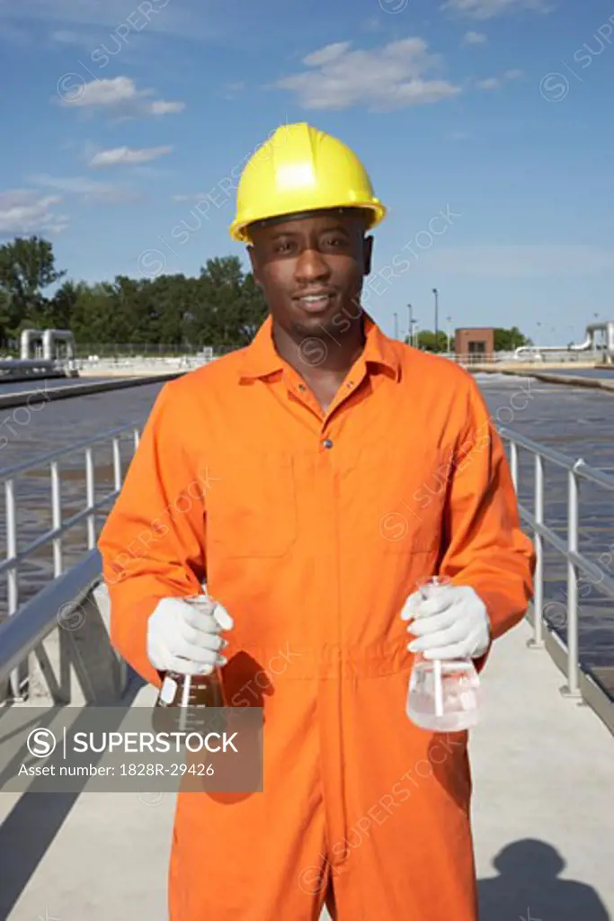 Man with Water Samples at Water Treatment Plant   