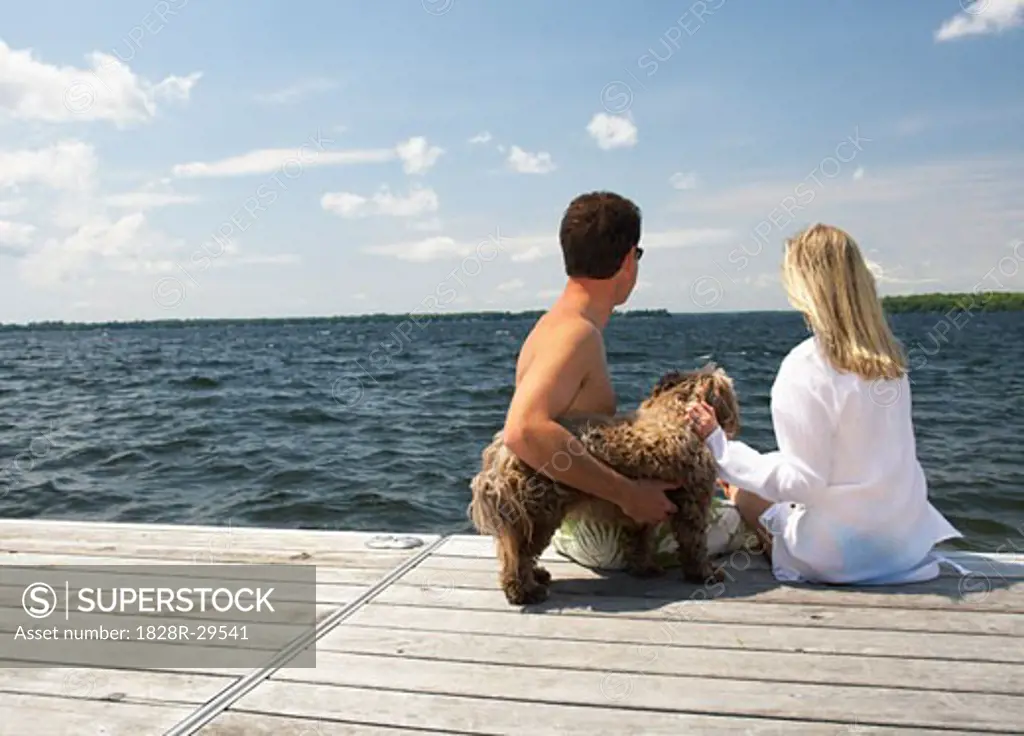 Couple on Dock With Dog   