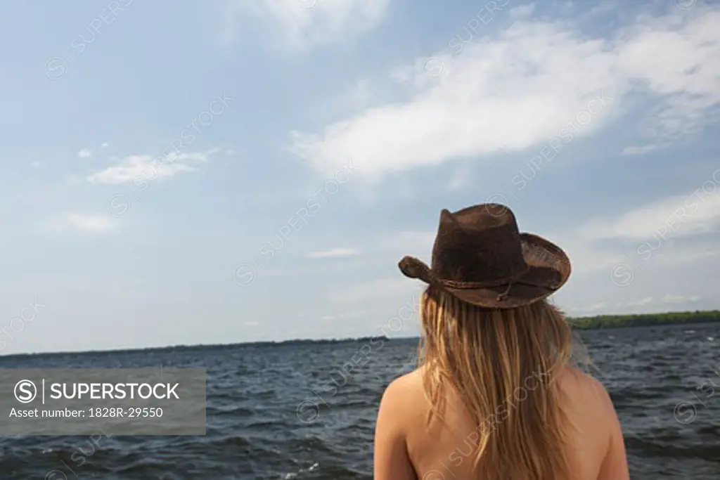 Woman Looking Out Onto Lake   
