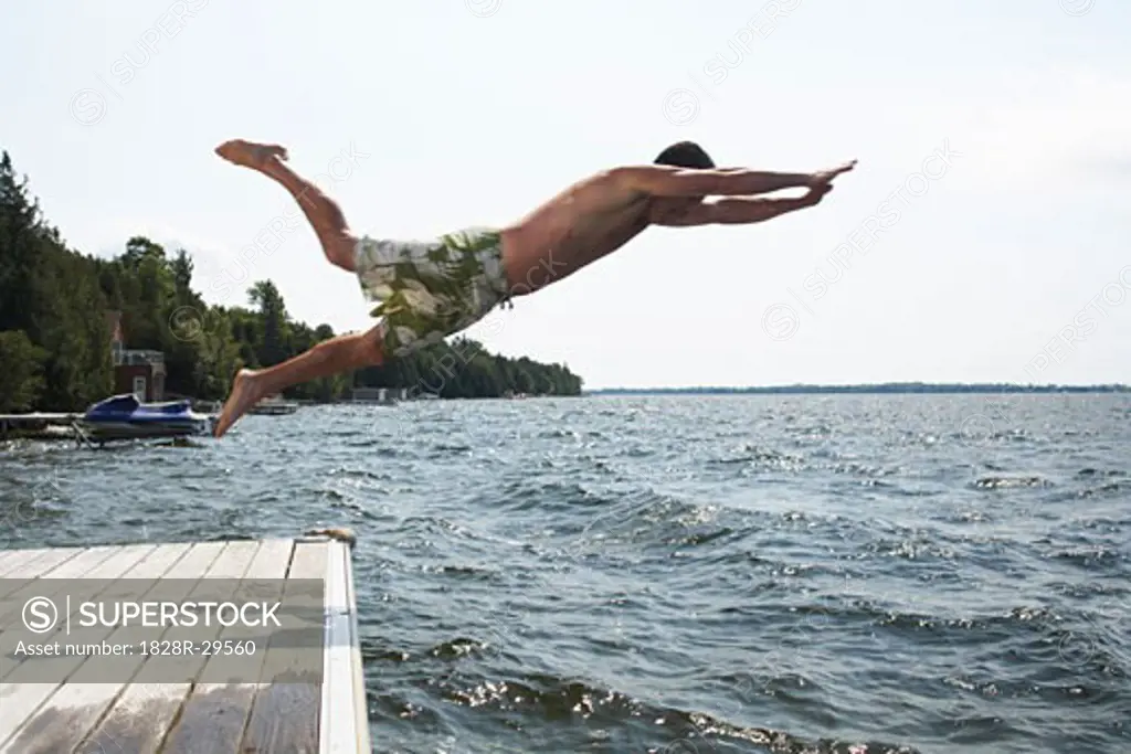 Man Jumping Into Lake   