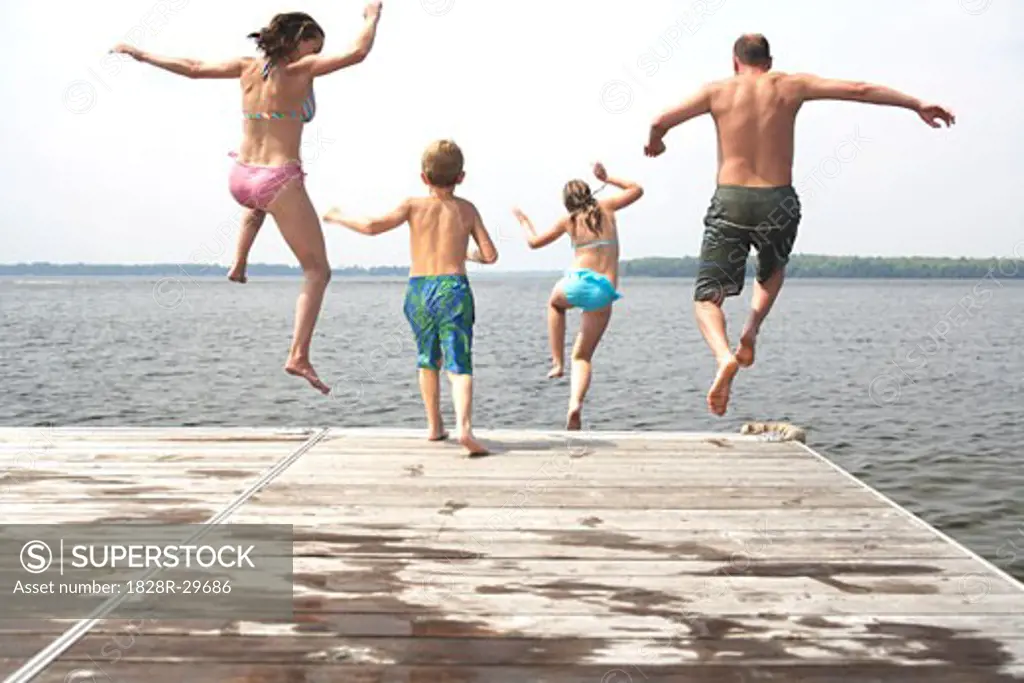 Family Jumping from Dock   