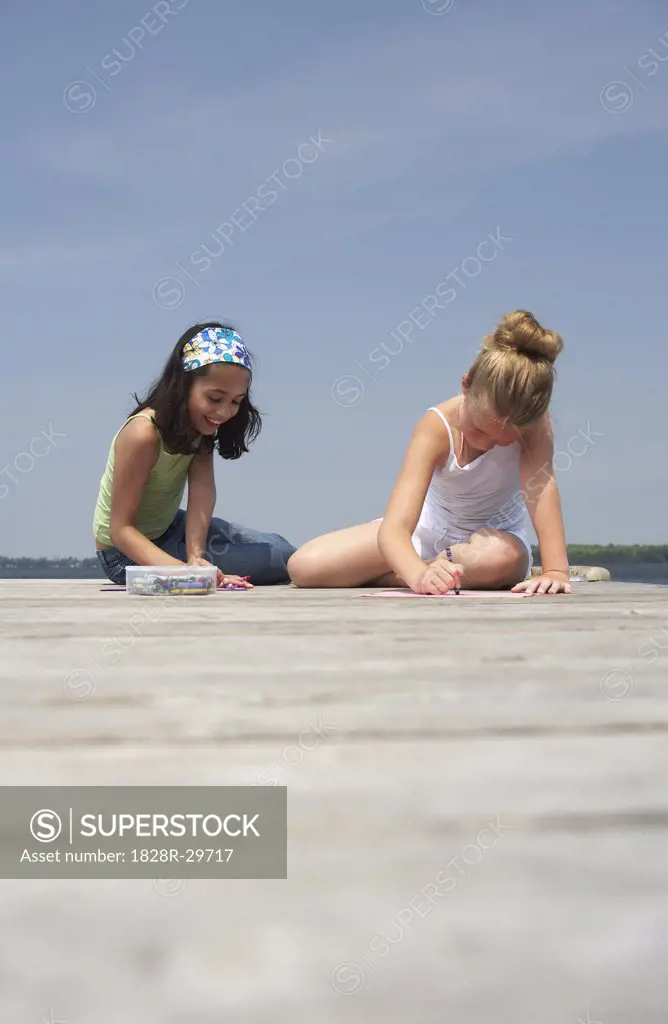 Girls Sitting on Dock   