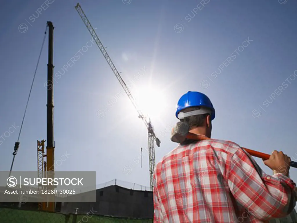 Construction Worker Holding Sledgehammer   