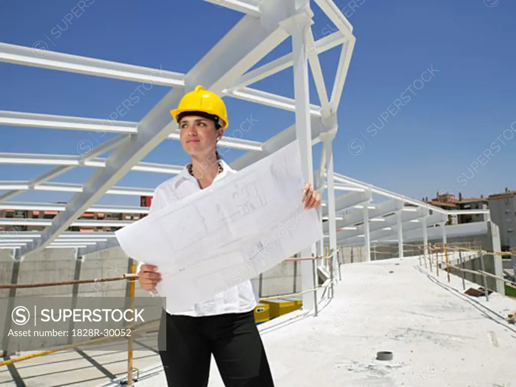 Engineer With Blueprints   