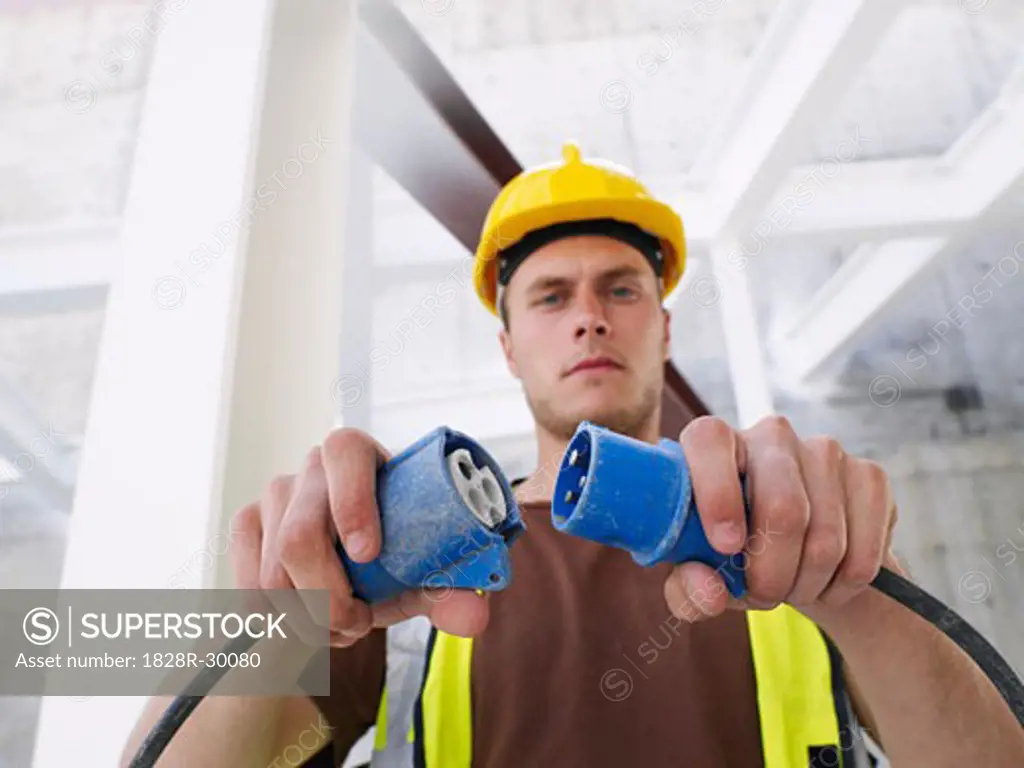 Construction Worker With Electrical Cord   