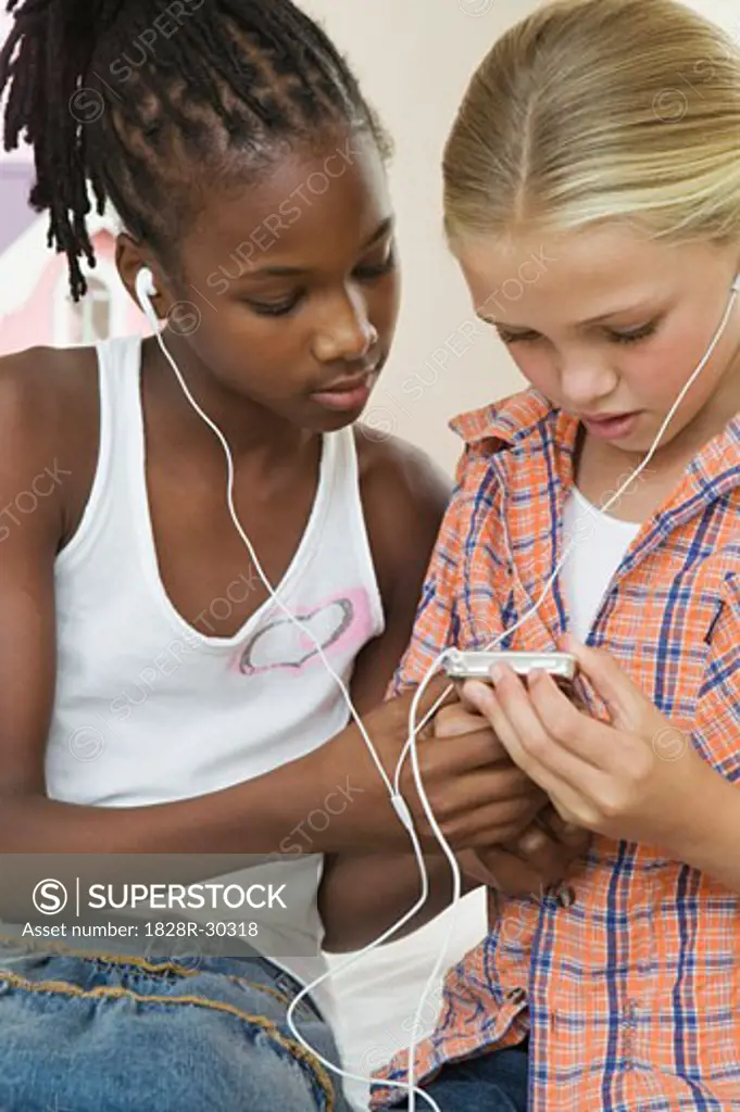 Girls Listening to MP3 Player   