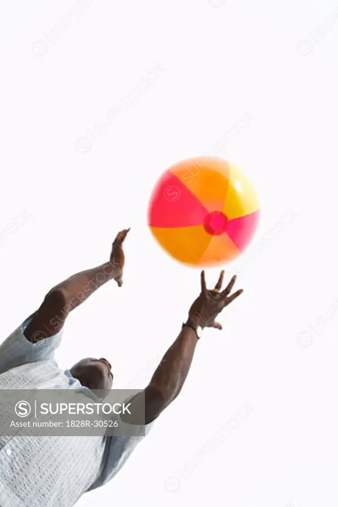 Man Playing with Beach Ball   