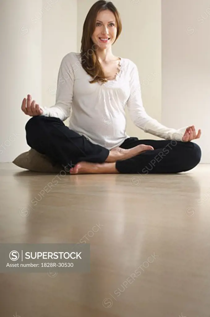 Pregnant Woman Practicing Yoga   