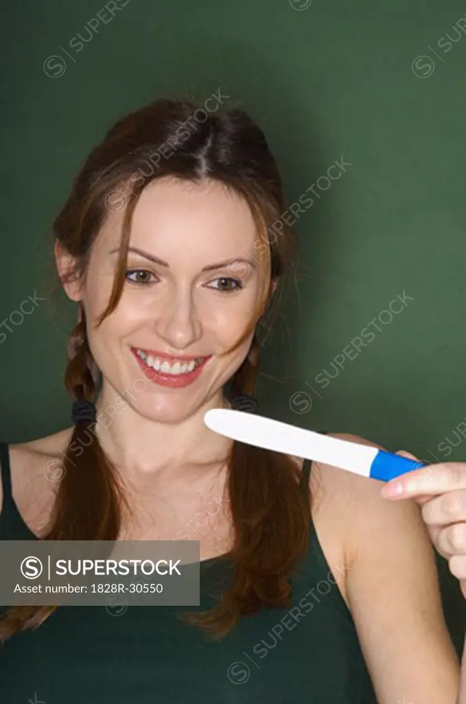 Portrait of Woman with Pregnancy Test   