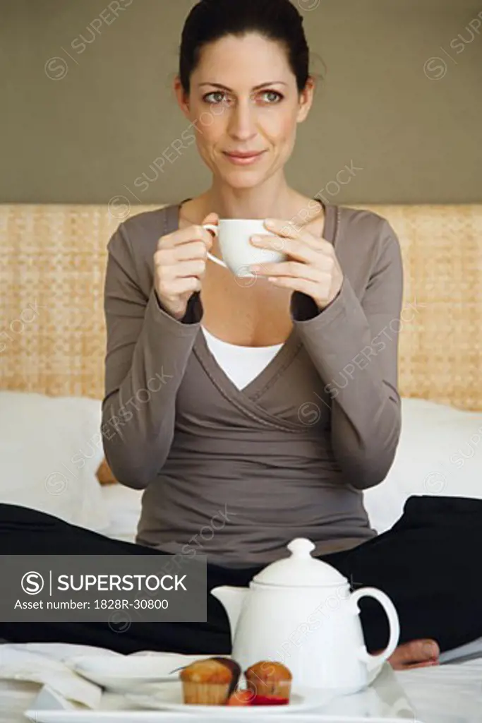 Woman Having Tea on Bed   