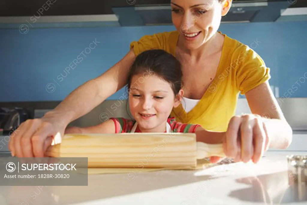 Mother and Daughter Rolling Cookie Dough   