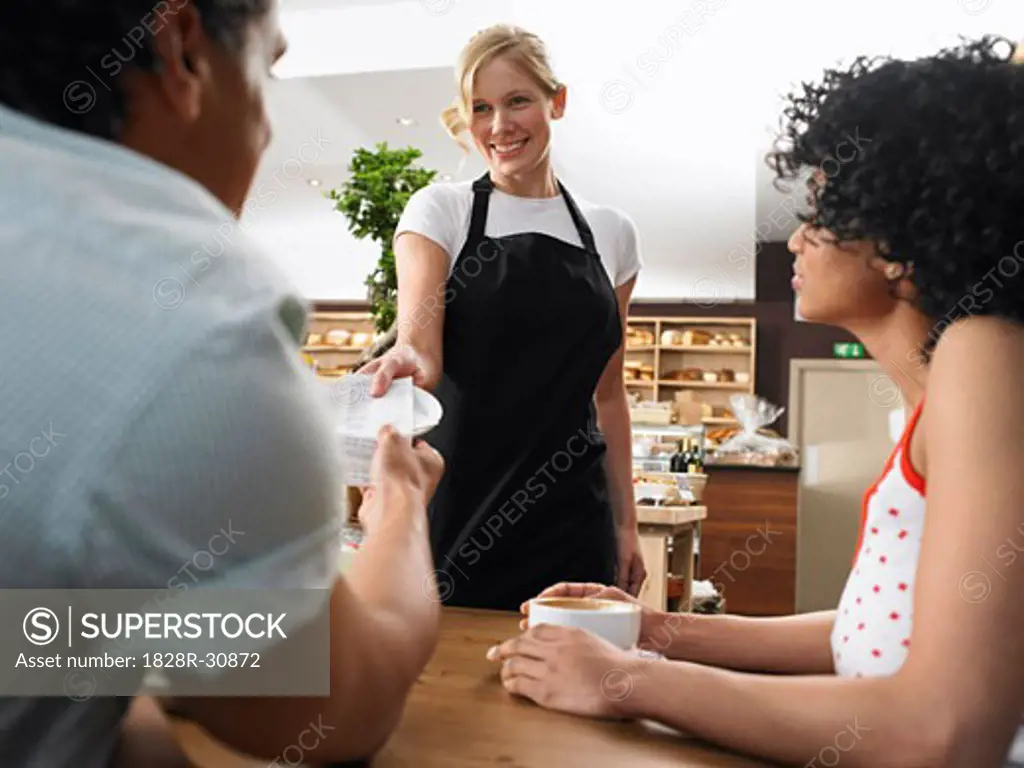 Couple and Waitress in Cafe   
