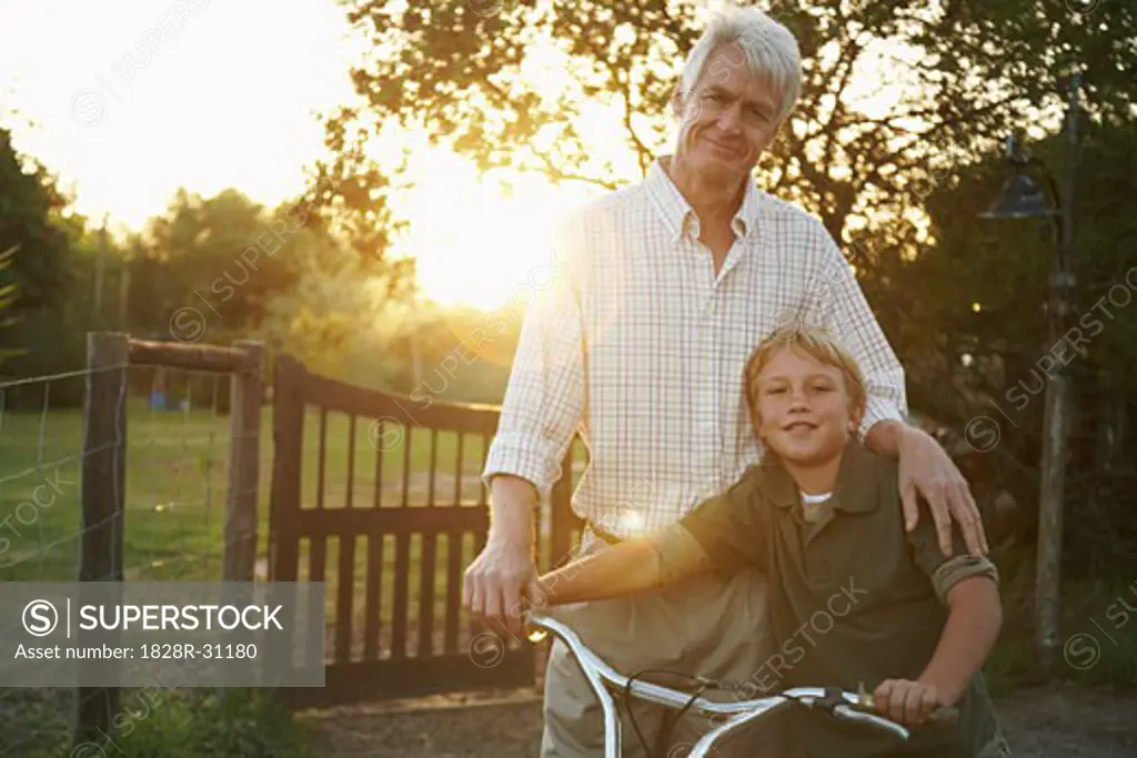 Grandfather and Grandson With Bicycle   