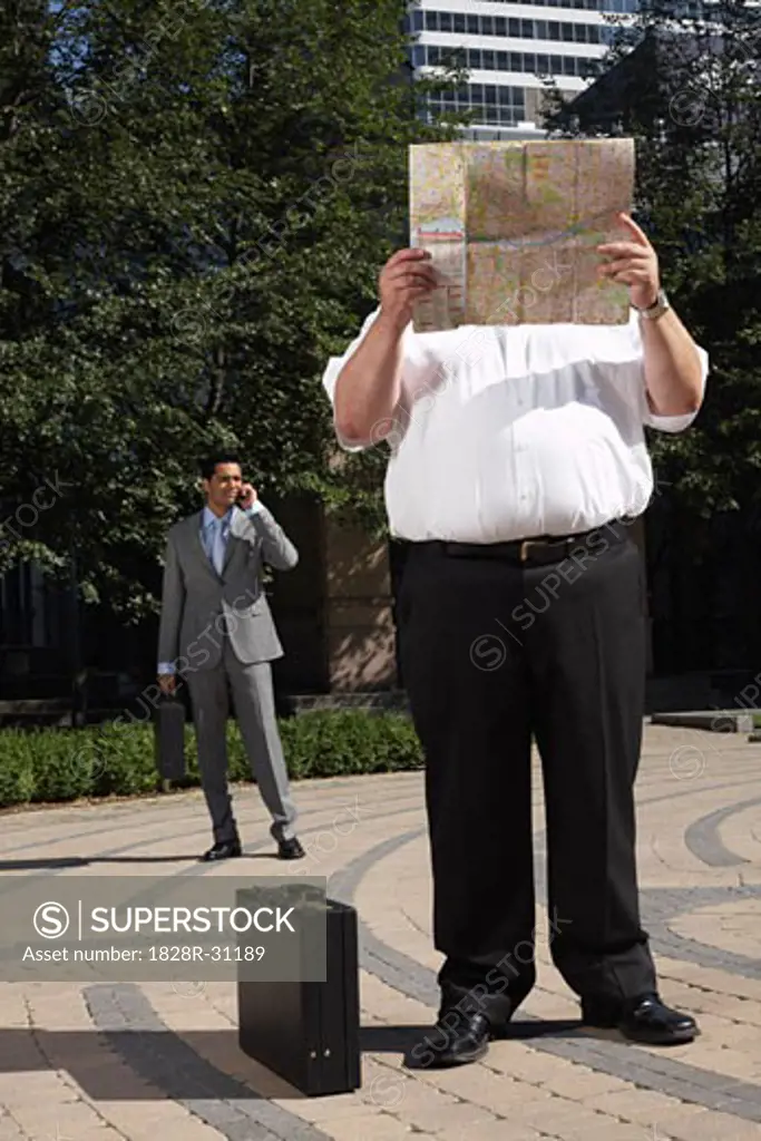 Businessman Looking at Map   
