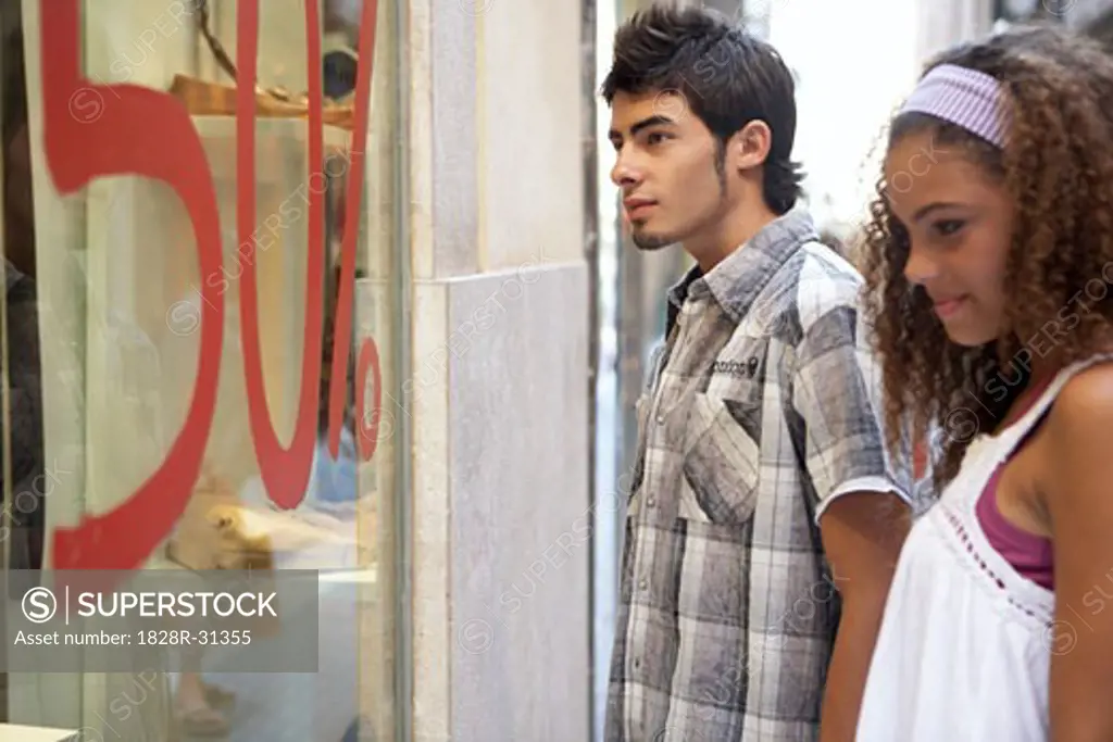 Young Man and Woman Window Shopping   
