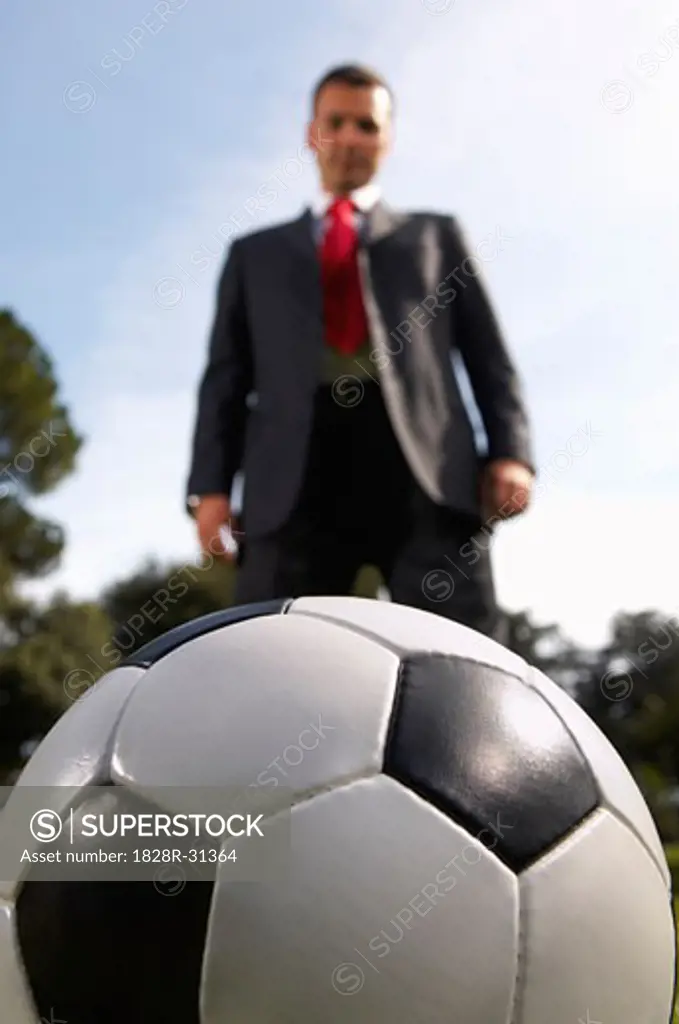 Businessman Playing Soccer   