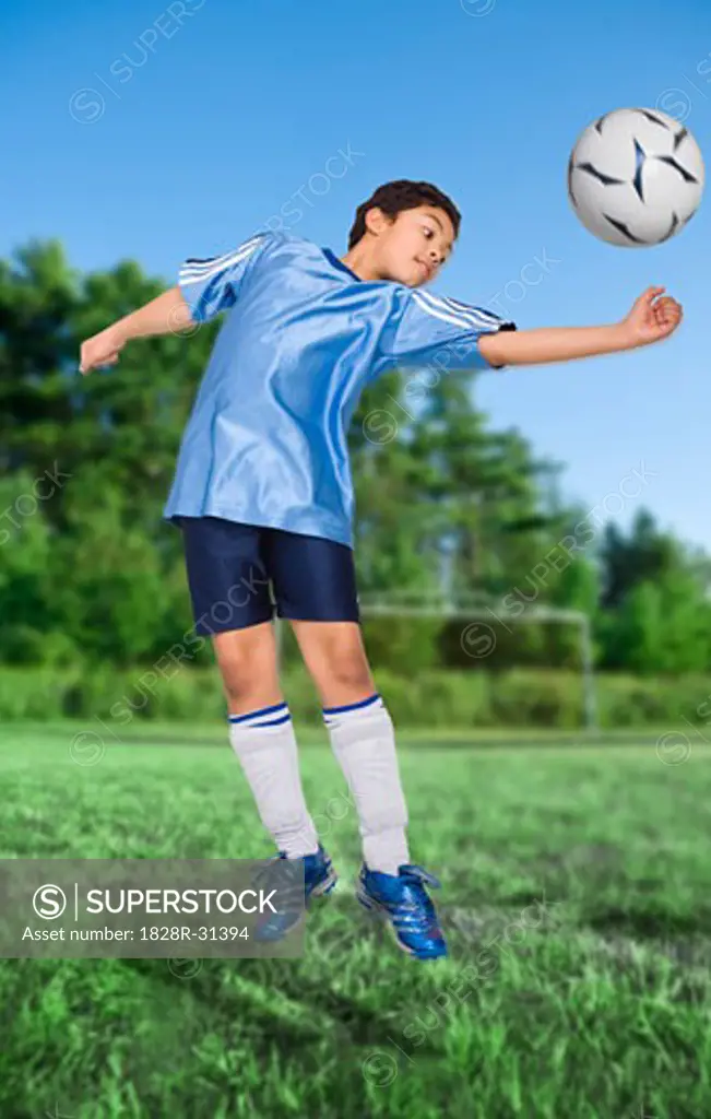 Boy Playing Soccer   