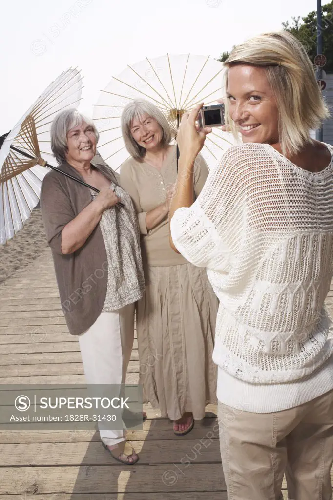 Women Posing for Picture on Boardwalk   
