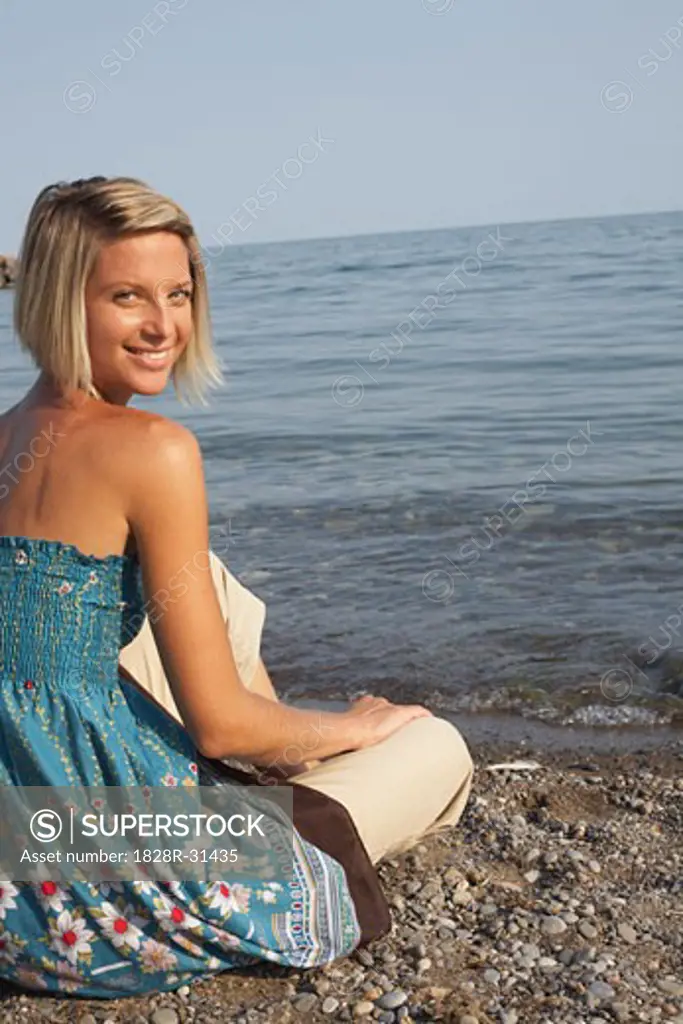 Woman Sitting on Beach   