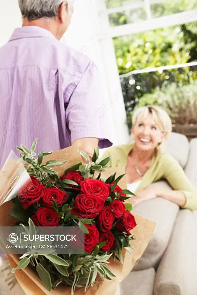 Man Giving Flowers to Woman   