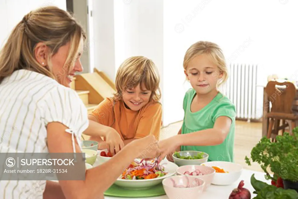 Mother and Children in Kitchen   