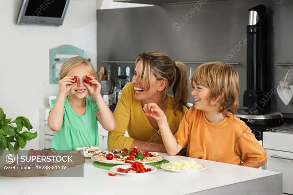 Mother and Children in Kitchen   