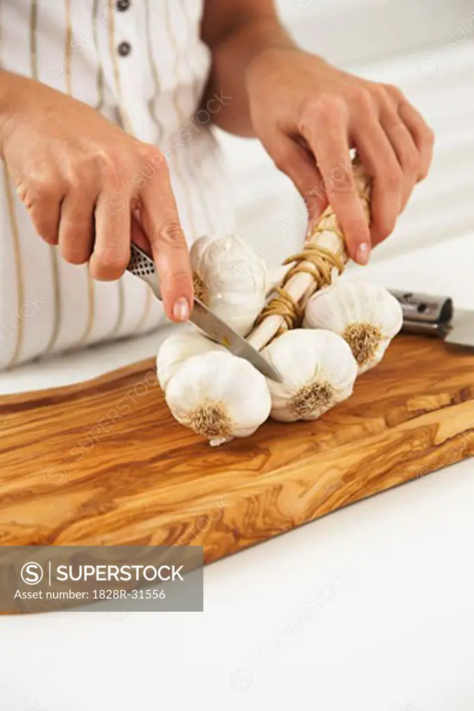 Woman Cutting Garlic   