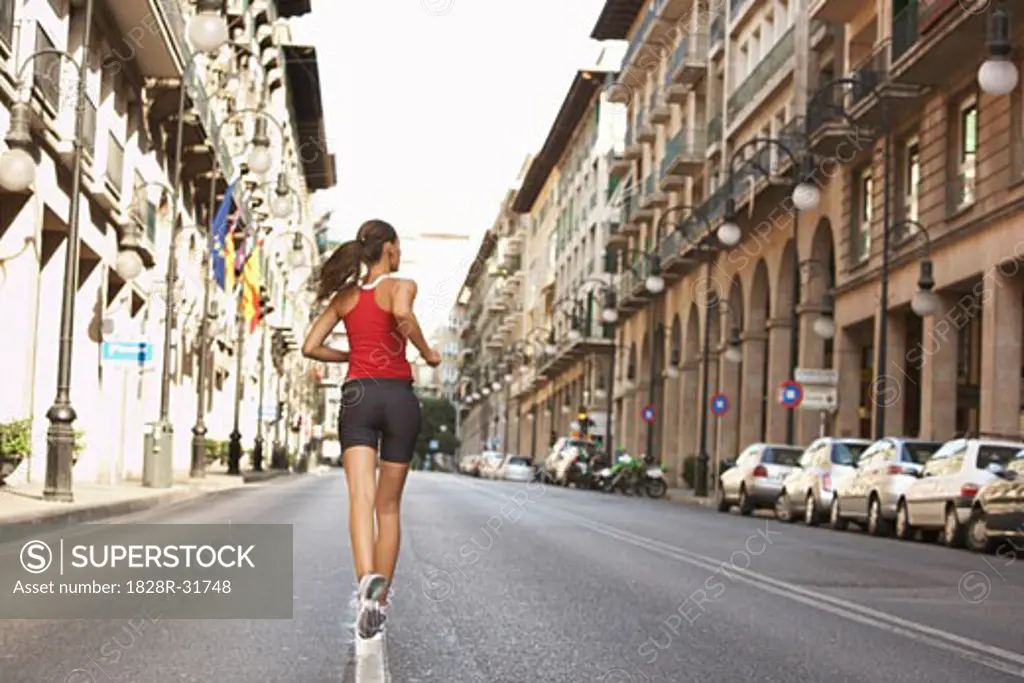 Woman Jogging on Street   