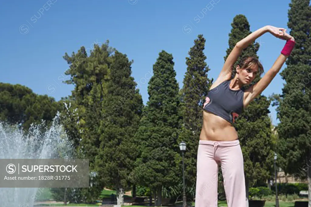 Woman Stretching at Park   