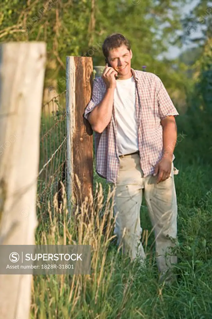 Farmer Using Cell Phone   