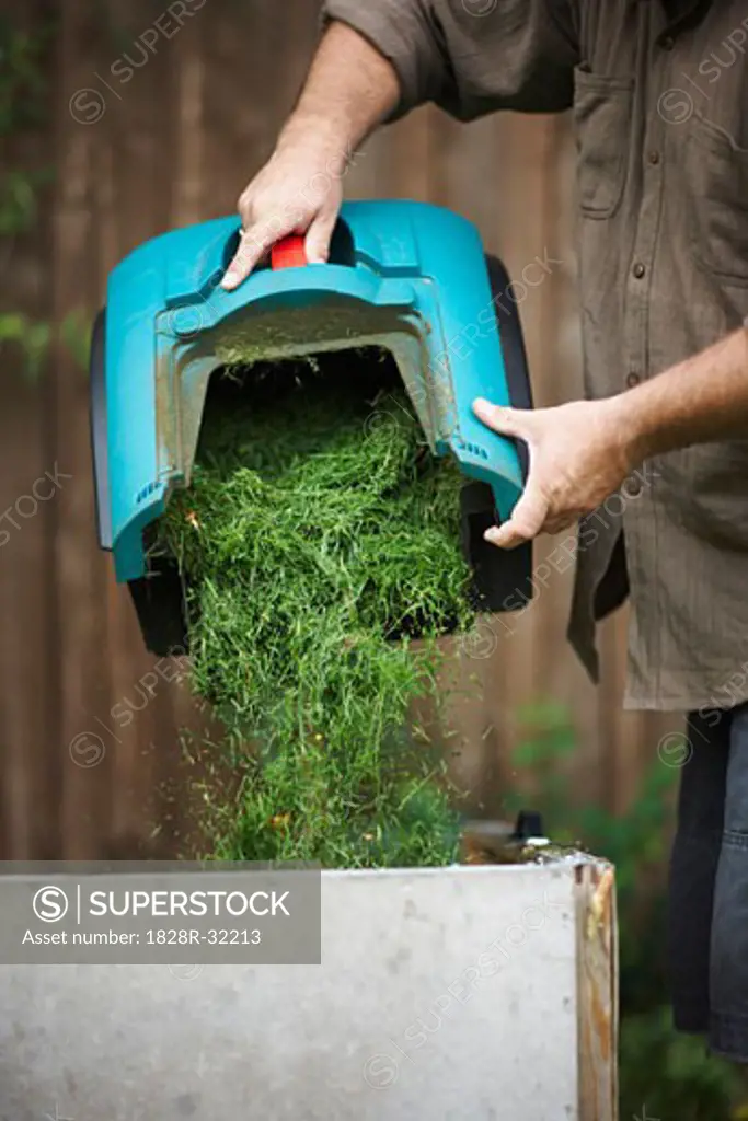 Man Emptying Grass Clippings   