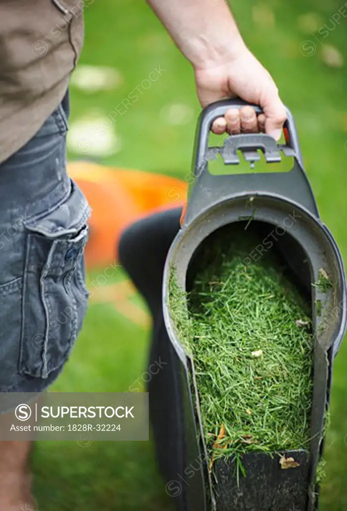 Man Emptying Grass Clippings   