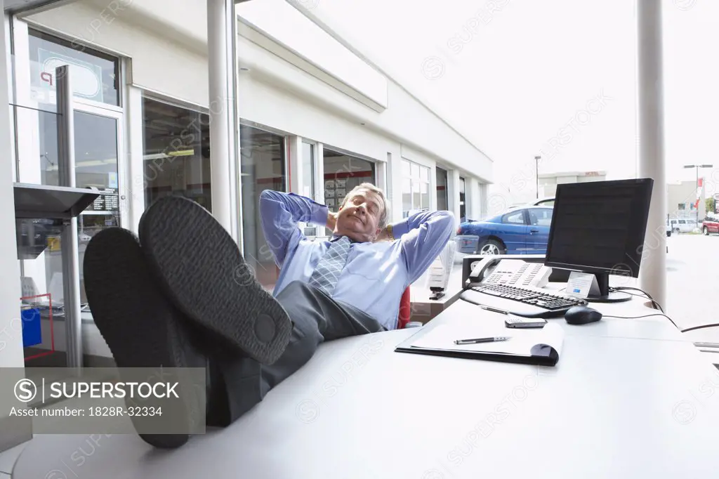 Businessman Sleeping in Office   