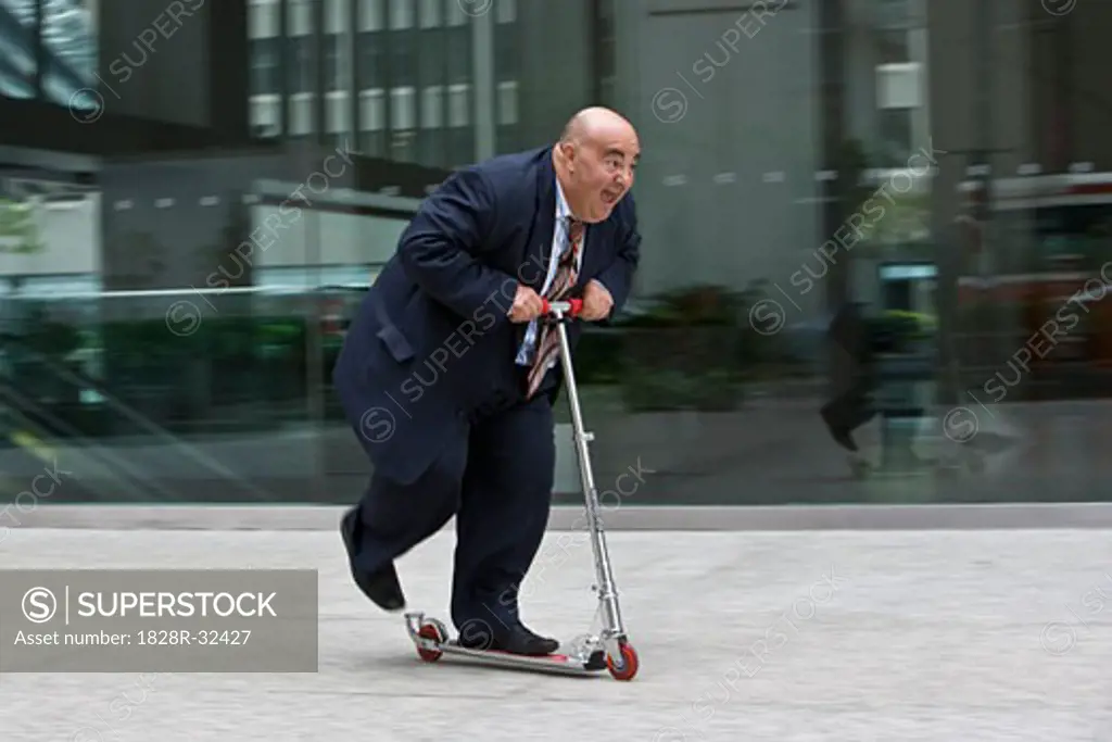 Businessman on Scooter   